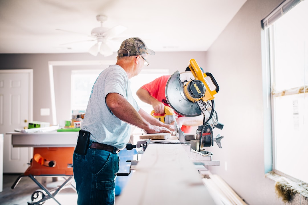 man-standing-infront-of-miter-saw-wewtgkpuvt0